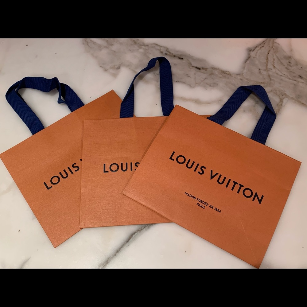 Three (3) Louis Vuitton paper bags (empty)